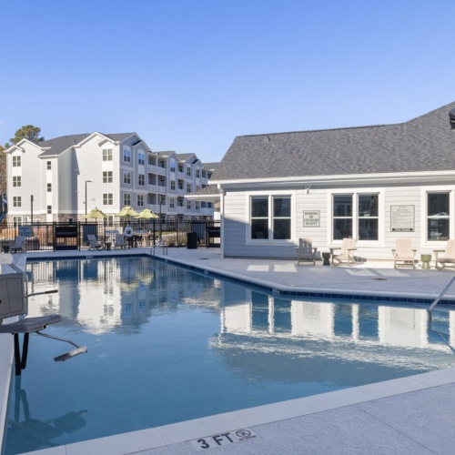Shimmering resort-style pool swimming pool in a courtyard