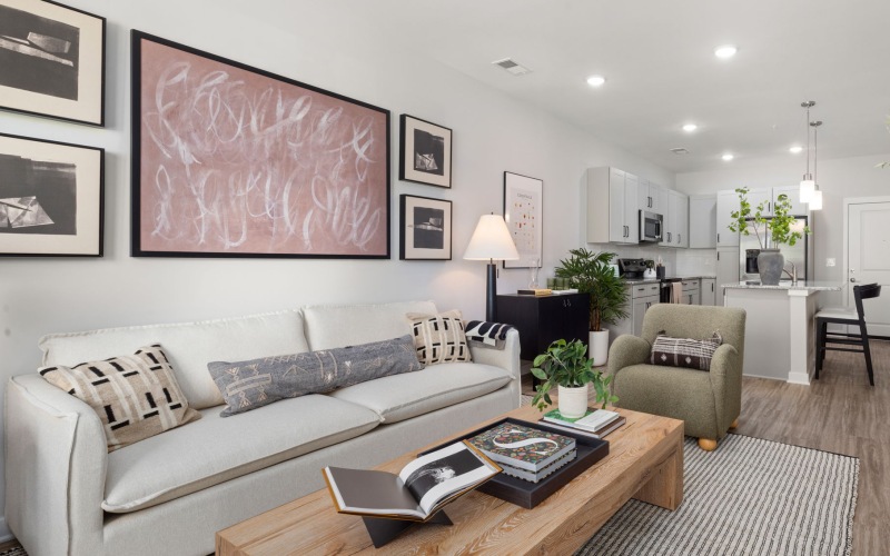 Staged living room opening up to the kitchen area